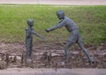 Part of a sculpture group at the Nortel Corporate Headquarters in Richardson, Texas, featuring boys with a handmade walkie-talkie.