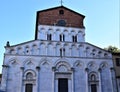 Part of the shadowed facade of the Santa Maria Forisportam church in Lucca.