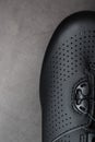 Part of Shoes made of black perforated leather close-up. Royalty Free Stock Photo