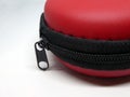 Part of small red case with black zipper