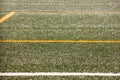 Part of sport soccer stadium and artificial turf football field. Detail, close up of green grass with white lines, goal line. Royalty Free Stock Photo