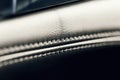 Part of stitched leather black leather car interior. Modern luxury car black leather interior. Car leather interior details with w Royalty Free Stock Photo