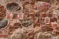 Part of a stone wall made of old bricks and boulders. Royalty Free Stock Photo