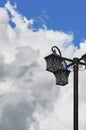 Street lamp on the background of the sky with clouds.
