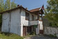 Part of street in the Paunovo village with old house, tree and fence, Sredna Gora mountain Royalty Free Stock Photo