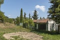 Part of street in the Paunovo village with old house, tree and fence, Sredna Gora mountain Royalty Free Stock Photo