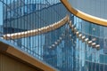 Part of a super modern business building against the blue sky Royalty Free Stock Photo