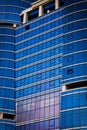 Part of a tall modern glass building Royalty Free Stock Photo