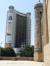 Part of the Tashkent Chorsu Madrasah of Kukaldash in contrast with a modern building. Uzbekistan.