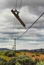 Part of a telephone pole hangs broken Royalty Free Stock Photo