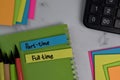Part-Time or Full Time write on sticky notes isolated on office desk