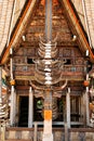 Part of tongkonan house with horns of buffaloes and wood carving and paintings. Kete Kesu in Tana Toraja, Sulawesi, Indonesia