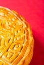 part of traditional Chinese mooncake on red with copy space vertical composition Royalty Free Stock Photo