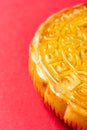 part of traditional Chinese mooncake on red with copy space vertical composition Royalty Free Stock Photo