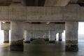 part under the Vasco da Gama bridge in perspective of infinity with the supporting pillars visible. Royalty Free Stock Photo