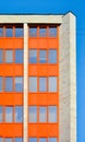 Part of urban future building on blue sky. City office building, orange wall Royalty Free Stock Photo