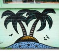 Part of urban mural with island and palm trees