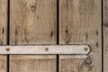 Part of a very old wooden door with a white lacquered bracket Royalty Free Stock Photo