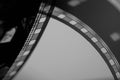 Part of vintage filmstrip or photo negative. Analog old strips of black and white film for photo or video camera close Royalty Free Stock Photo