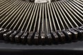 Part of vintage portable typewriter with letters Royalty Free Stock Photo