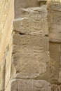 Part of wall with ancient Egyptian hieroglyphs and symbols in Karnak Temple complex (ancient Thebes). Royalty Free Stock Photo
