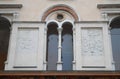 Part of a wall with arms of a building in front of the Cathedral of Crema in the province of Cremona in Lombardy (Italy)