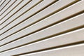 Plastic beige siding Royalty Free Stock Photo