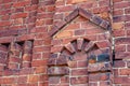 Part of the wall of a 19th century building made of old red brick. Urban background with a beautiful shape in Royalty Free Stock Photo