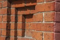 Part of the wall of a 19th century building made of old red brick. Urban background with a beautiful shape in Royalty Free Stock Photo