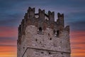 part of the walls of the Scaliger castle of the town of Sirmione at sunse