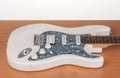 Part of white electric guitar, studio shoot.  2 x Single Coil and 1 x Humbucking. Black Pearl pickguard, Rosewood Fingerboard Royalty Free Stock Photo