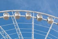 Part of white ferris wheel against blue sky Royalty Free Stock Photo