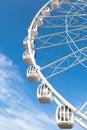 Part of white ferris wheel against blue sky Royalty Free Stock Photo