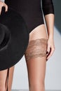 Part of woman body perfect shape hips legs skin tan wear stockings, nylons, pantyhose lingerie hosiery hose studio shot. on white Royalty Free Stock Photo