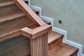 Part of wooden steps with glass railings. Walnut staircase Royalty Free Stock Photo