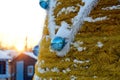 Part yellow Christmas tree with ornaments on sun background