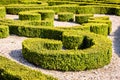 Low hedges of box tree pruned in geometric shapes in a french formal garden