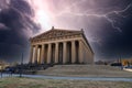 The The Parthenon in Centennial Park with tall brown stone pillars around the building with gorgeous autumn colored trees