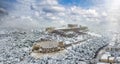 The Parthenon Temple and the Herodion Theater at the Acropolis of Athens with snow