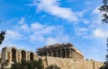 The Parthenon under renovation on the Acropolis of Athens Greece with the Odeon of Herodes Atticus - stone theatre structure locat