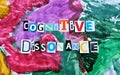 Partial blurred cut out colored letters from magazines and compilation of cognitive dissonance Royalty Free Stock Photo