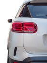 A partial close-up of the rear taillights of a white Citroen C5 aircross SUV