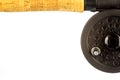 Partial Cork Fishing Rod Handle and Fly Reel on White Royalty Free Stock Photo