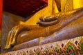 Massive Gilded Buddha Image in the Grand Shrine Hall of Wat Phra That Chang Kham Worawihan, Nan Province, Northern Thailand Royalty Free Stock Photo