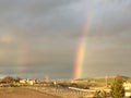 Partial Double Rainbow with green grass and young vineyard - Paso Robles, California Royalty Free Stock Photo