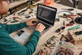 Partial male IT engineer programming code of chip