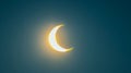 Partial solar eclipse against a dark sky. Bright crescent sun during an eclipse. Concept of astronomy, celestial event Royalty Free Stock Photo
