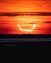 Partial solar eclipse as the moon passes in front of the sun.