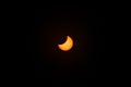 Partial solar eclipse in maximum phase, observation from Poland. The moon obscures the disk of the sun. Royalty Free Stock Photo