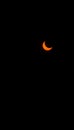 Partial solar eclipse at sun isolated on black background with space for text copy. Solar eclipse Royalty Free Stock Photo